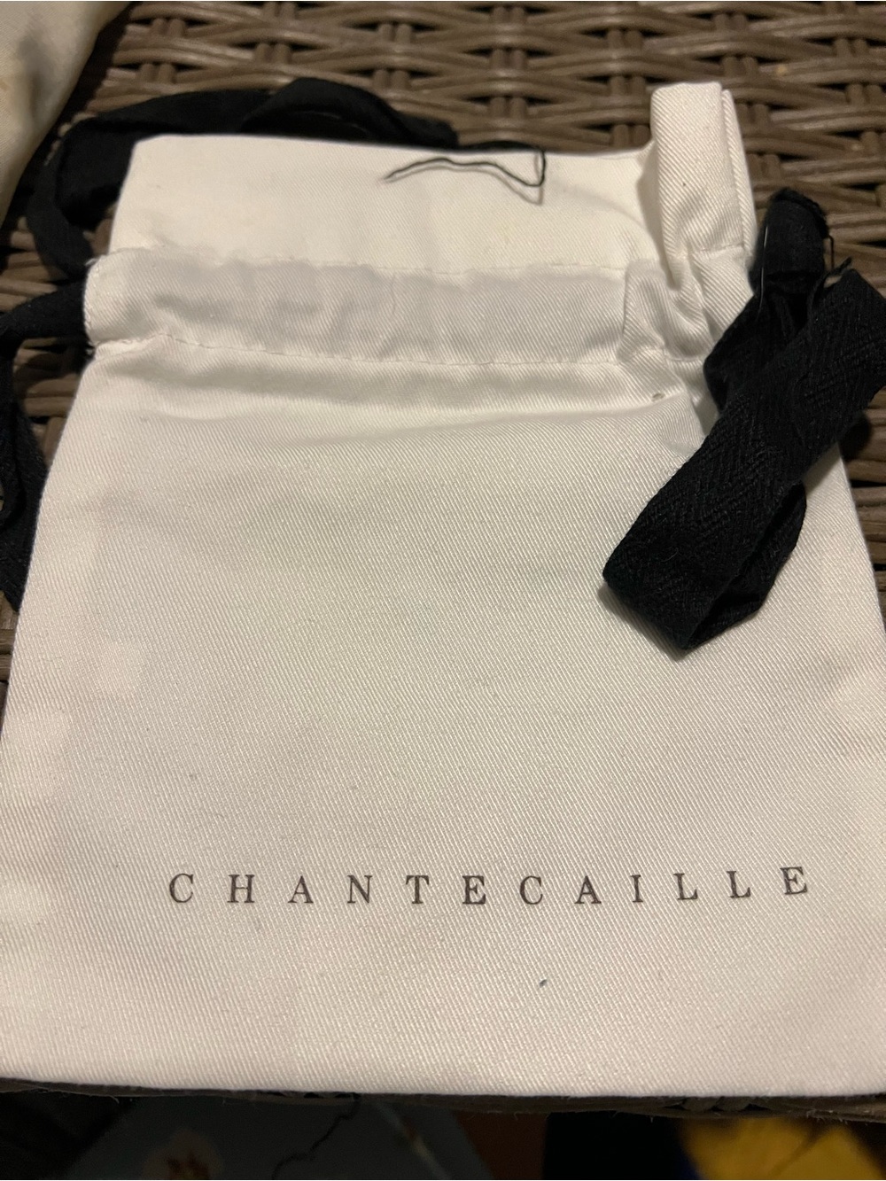 Chantecaille White Drawstring Pouch with Black Ties and Logo
